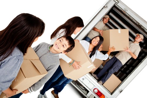 Removal van and packed boxes in Catford residential street
